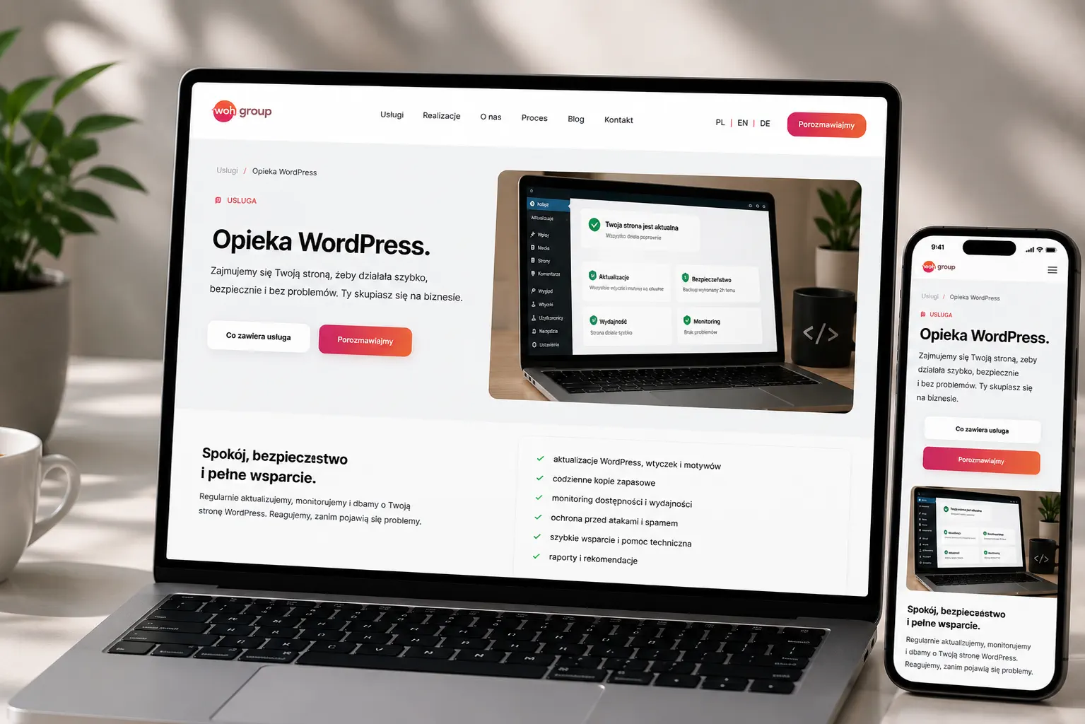 WOH GROUP WordPress Support displayed on a laptop in a bright, modern interior